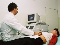 Normal AL ultrasound technician with patient